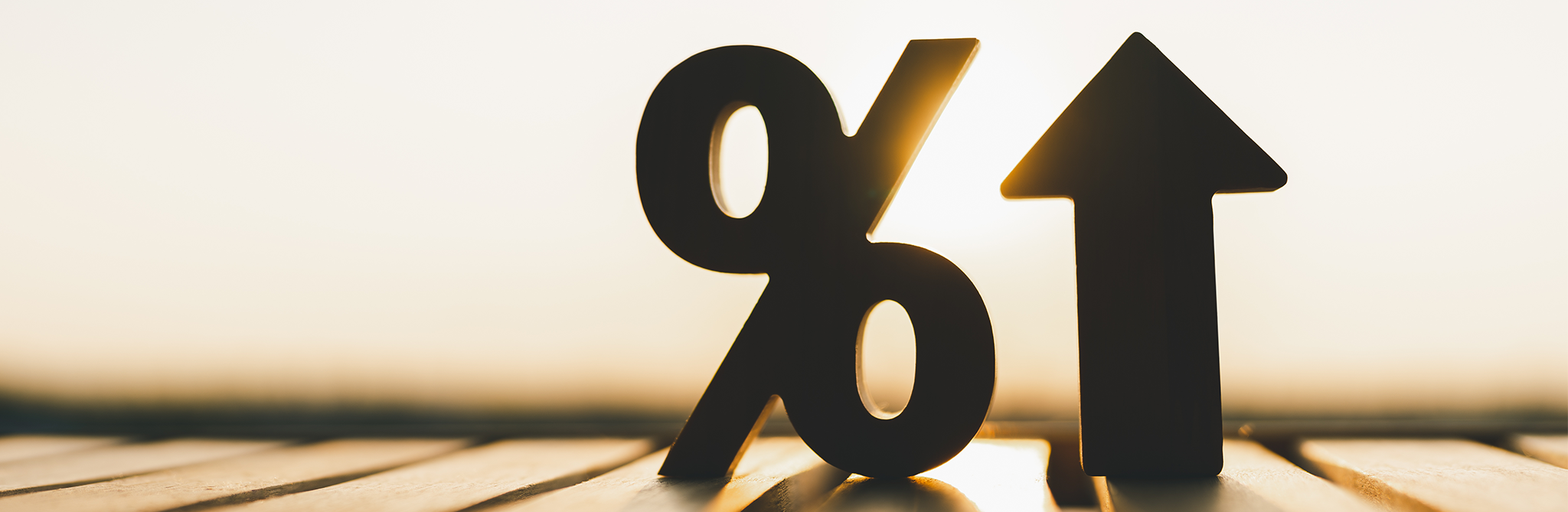 An arrow pointing up next to a percentage sign.