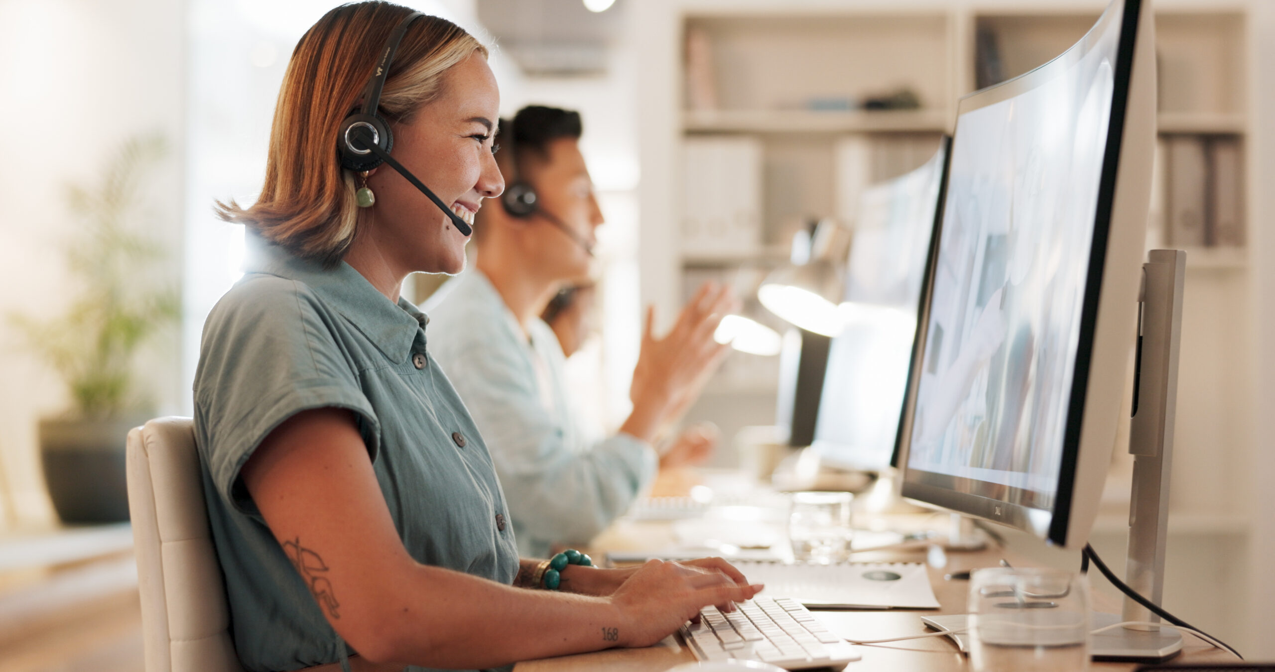 Woman wearing a headset on a video call.