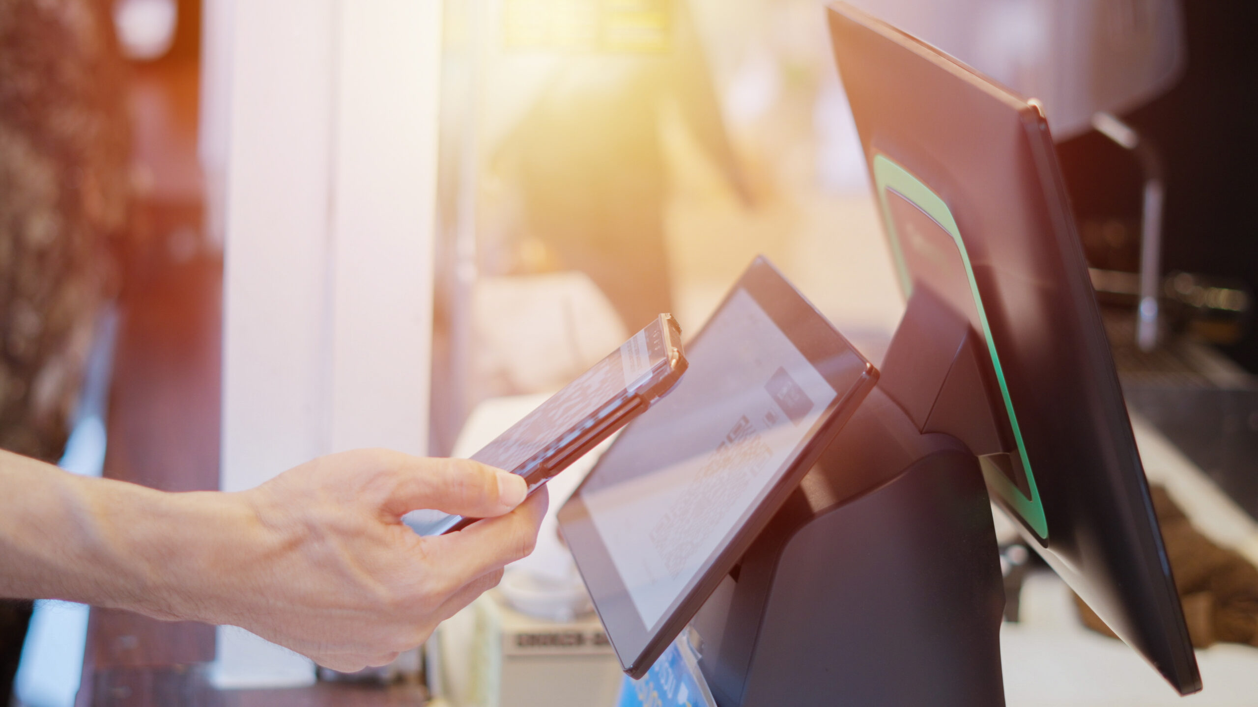 Person paying with their phone.